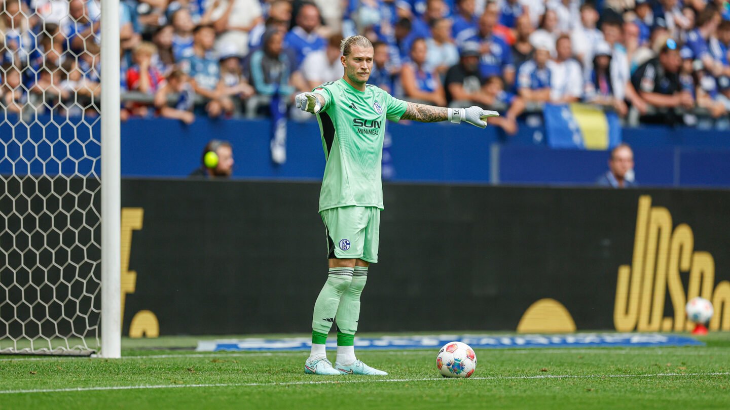 Loris Karius with the ball at his feet, pointing.
